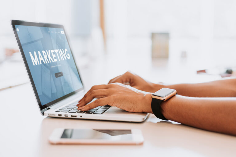 Millennial black lady with credit card, laptop and smartphone buying online on website or app. Purchasing goods in internet, online shopping and sale, banking and fashion store